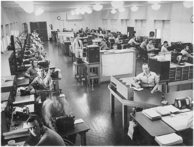 Navy radio intelligence operations room with rows of intercept desks