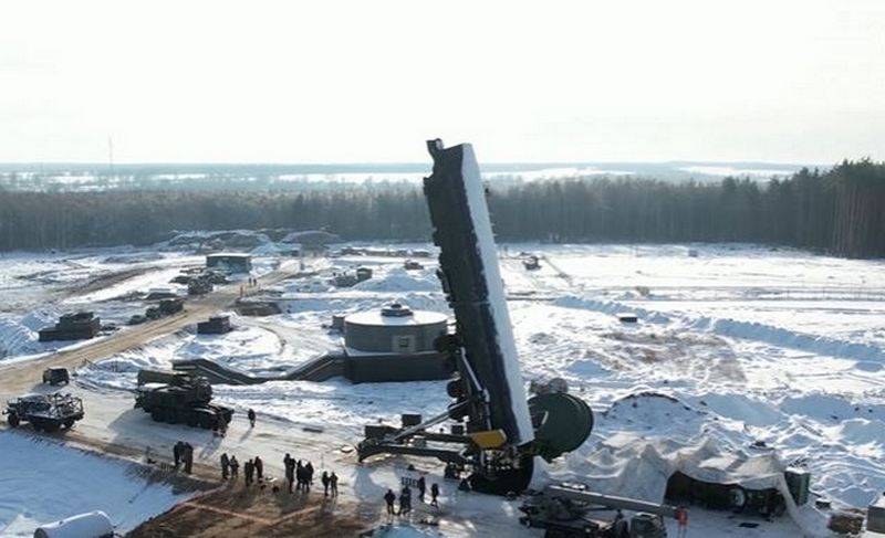 RS-24 Yars erector raising missile in snow